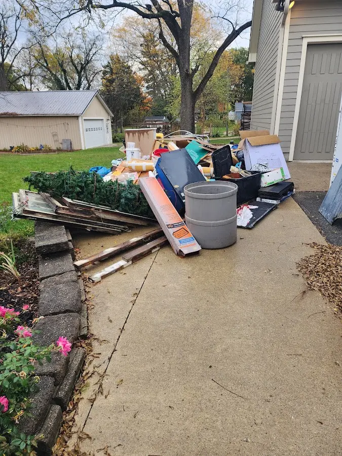 Dumpster being loaded with debris for 10 Yard Dumpster Rental in Mount Plymouth